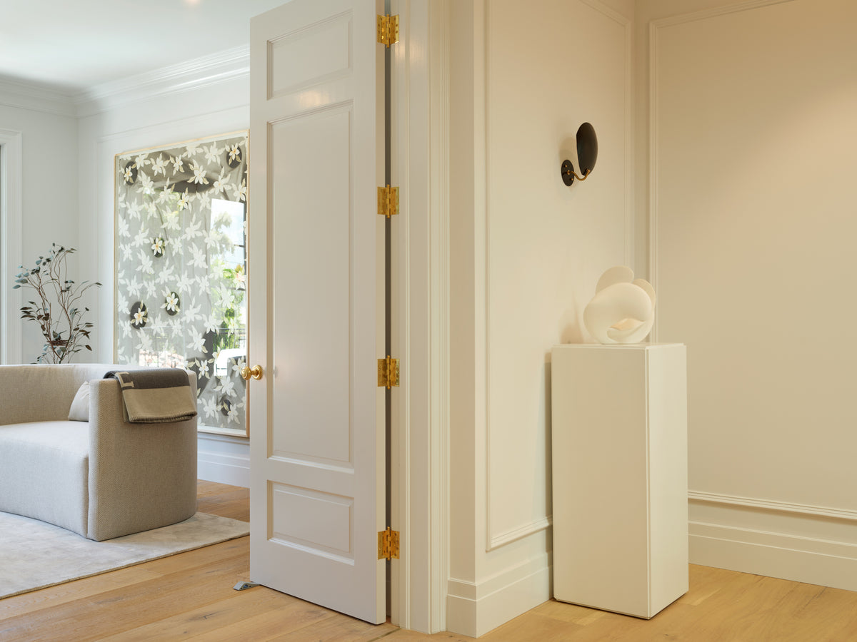 Sculpture on a plaster plinth in the hallway, Martin & Brockett Beverly Hills
