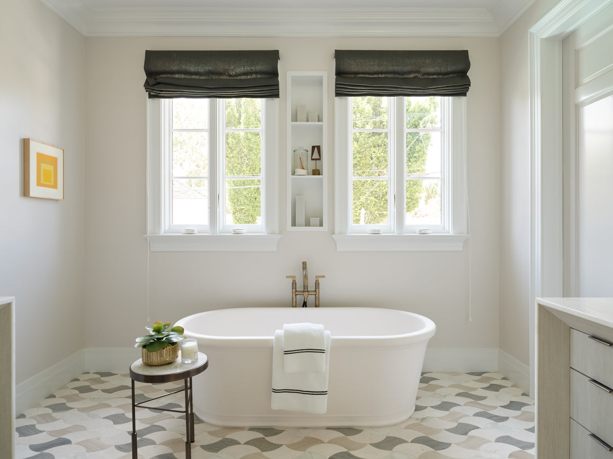 Freestanding tub on a geometric tile floor, Martin & Brockett Beverly Hills primary bathroom