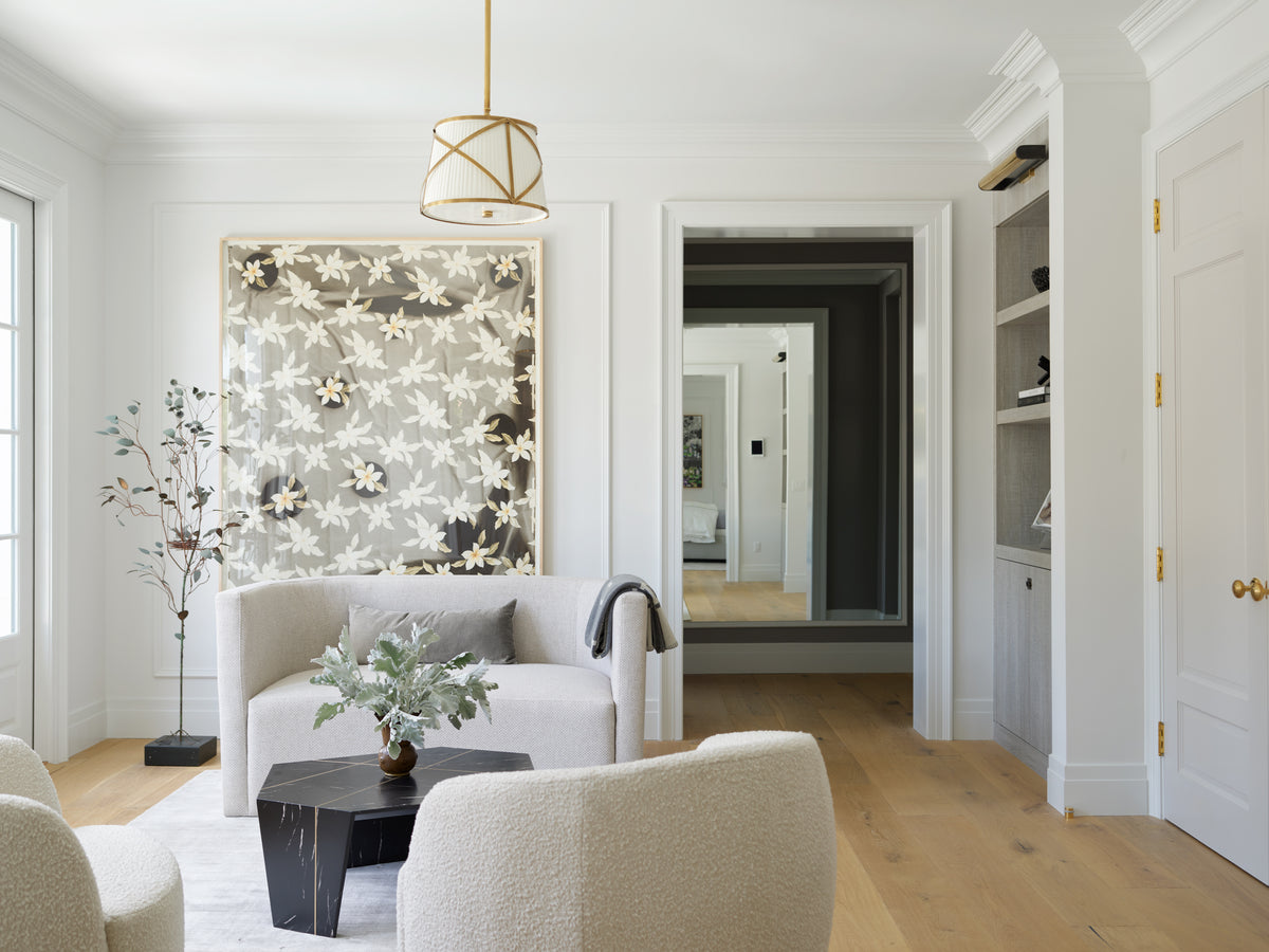 Black and white floral wallpaper behind boucle armchairs, Martin & Brockett Beverly Hills sitting room