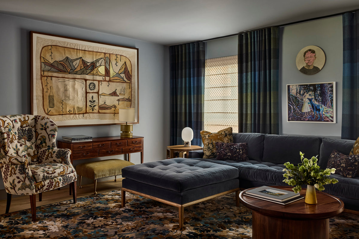 Large framed textile above an antique console beside a velvet sectional, Martin & Brockett Canyon