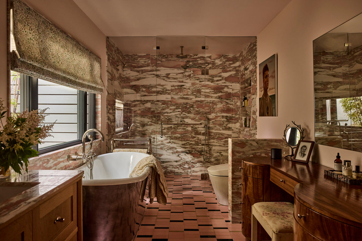 Rose marble shower beside a freestanding tub, Martin & Brockett Canyon primary bathroom