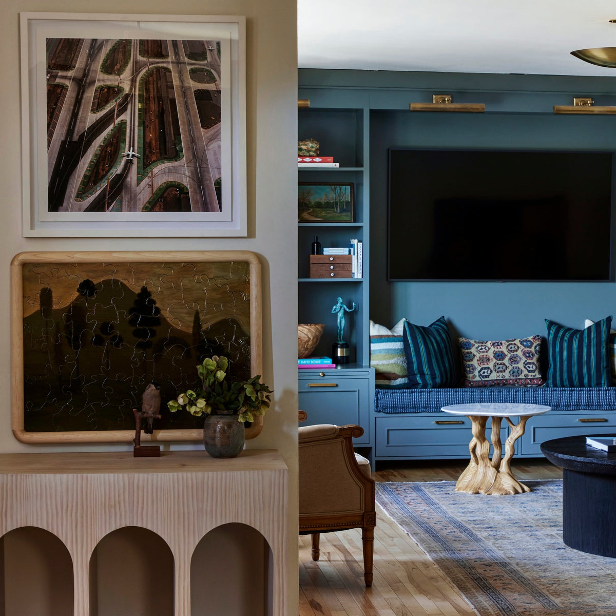 Blue built-in media wall and window seat with an arched console alongside, Martin & Brockett Eastside Hills
