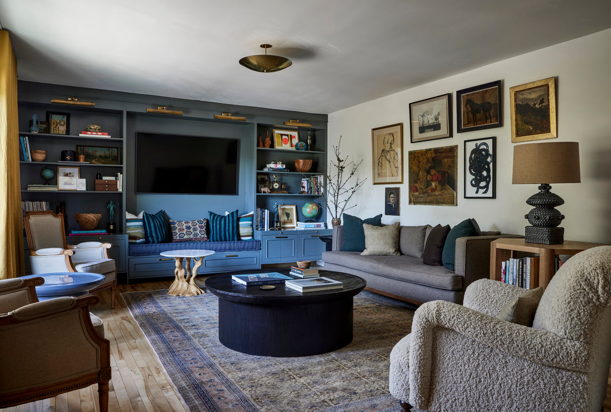 Blue built-in shelving and a window seat framing a vintage art collection, Martin & Brockett Eastside Hills