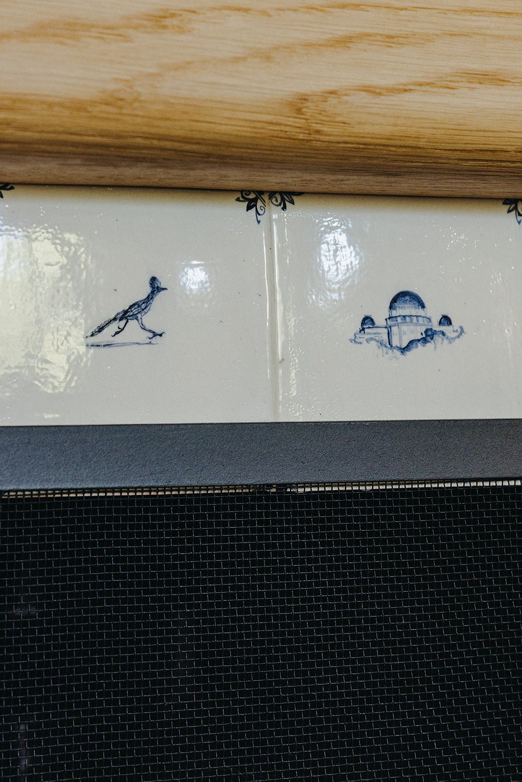 Oak mantel meeting the hand-painted Delft tile surround, Martin & Brockett Pasadena living room