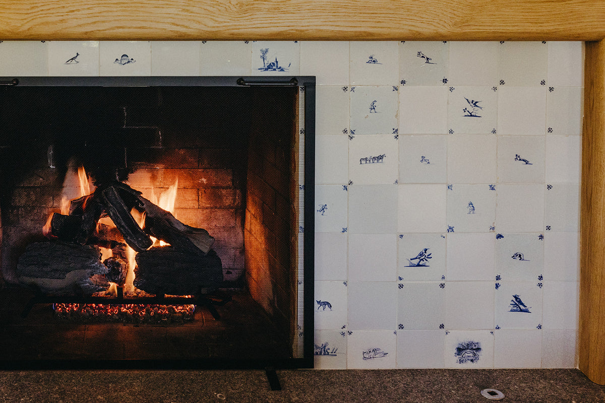 Blue and white Delft tile framing the firebox in Martin & Brockett's Pasadena project