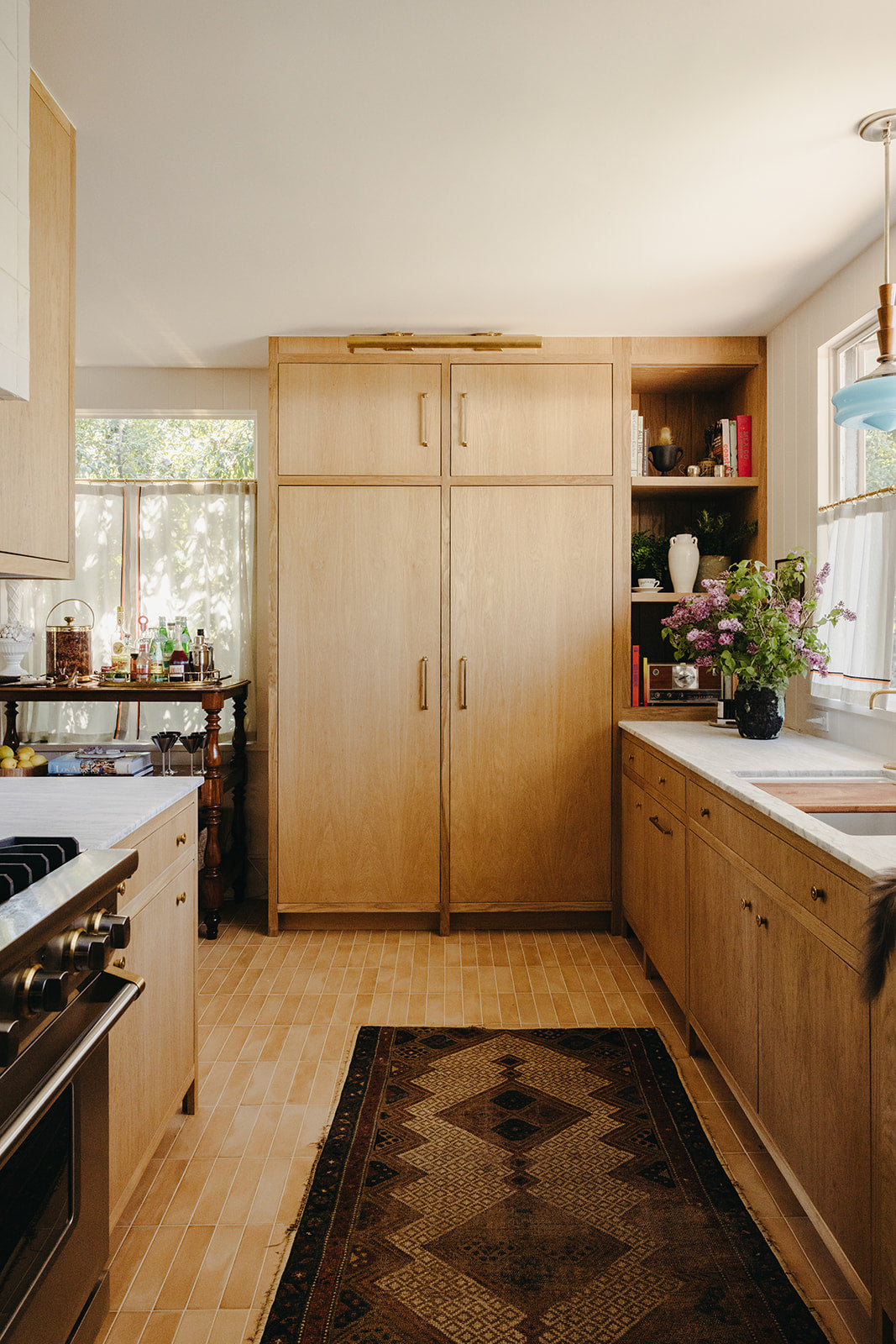 Patterned runner along oak cabinetry in the Pasadena kitchen by Martin & Brockett