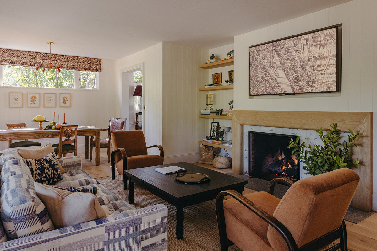 Framed antique map above the living room fireplace in Martin & Brockett's Pasadena project