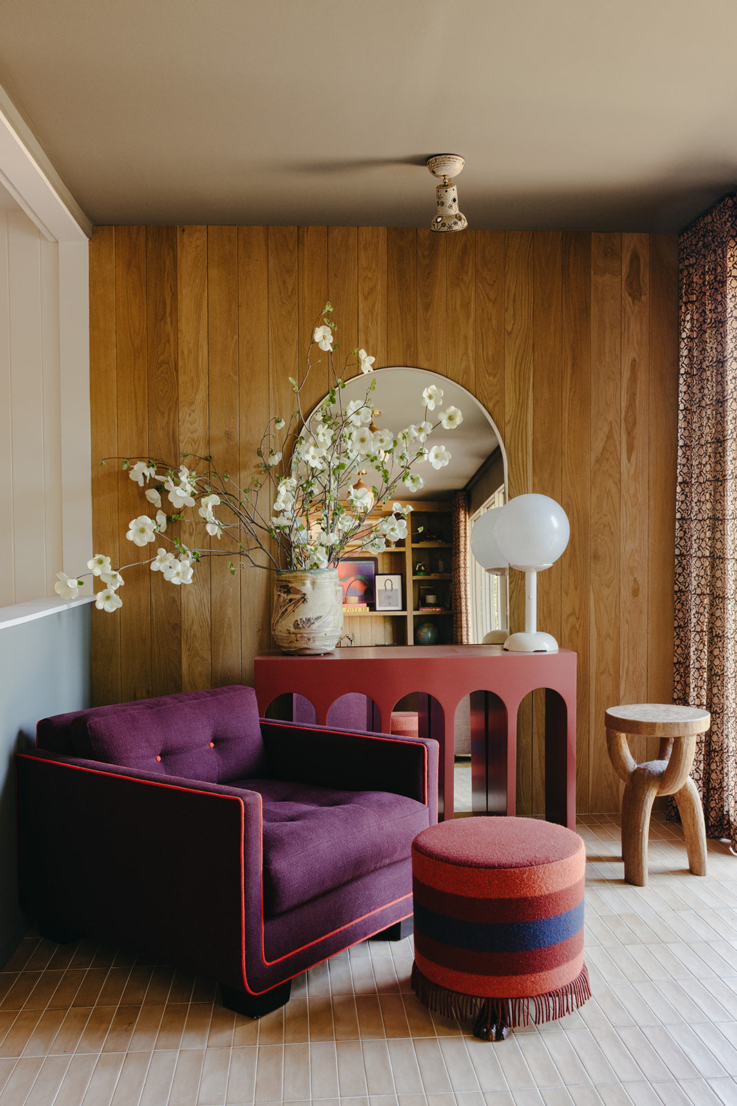 Purple velvet settee against walnut paneling in the Pasadena sitting room by Martin & Brockett
