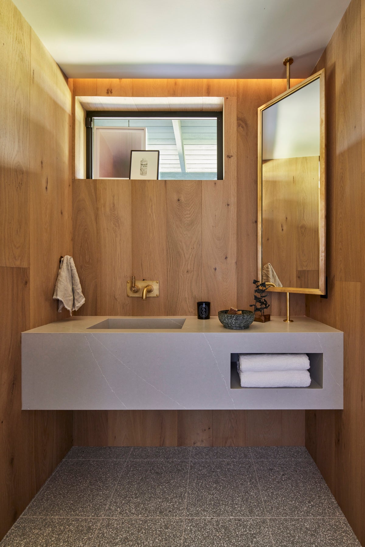 Oak-lined powder room above a terrazzo floor, Martin & Brockett San Rafael