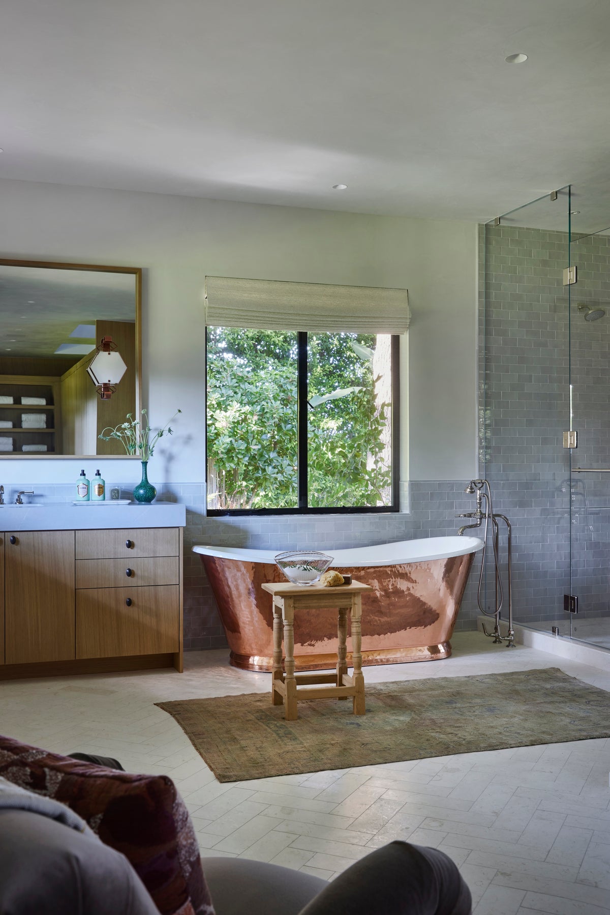 Copper freestanding tub beside the walk-in shower and window, Martin & Brockett San Rafael primary bathroom