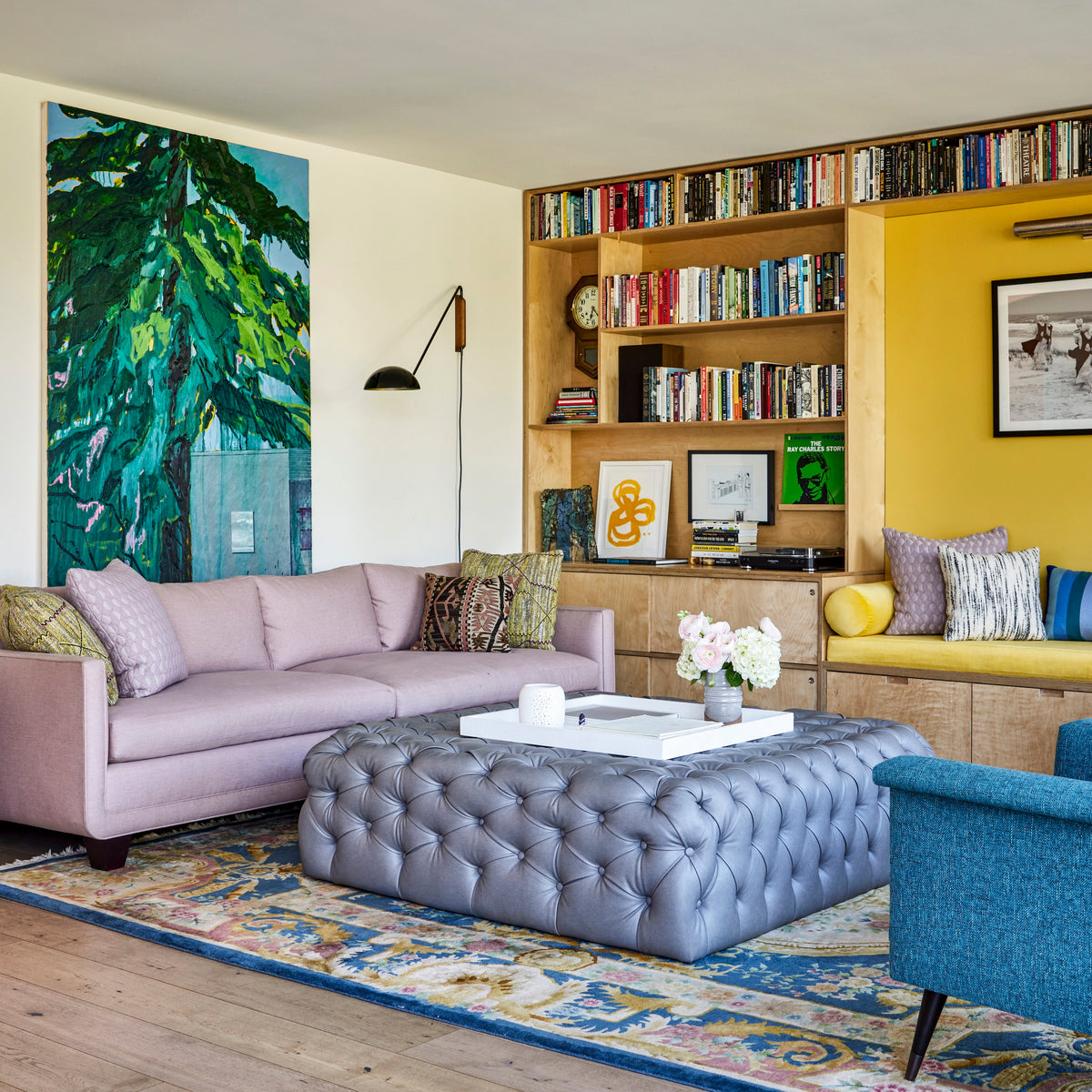 Botanical art panel beside oak shelving and a mauve sofa, Martin & Brockett Silverlake living room
