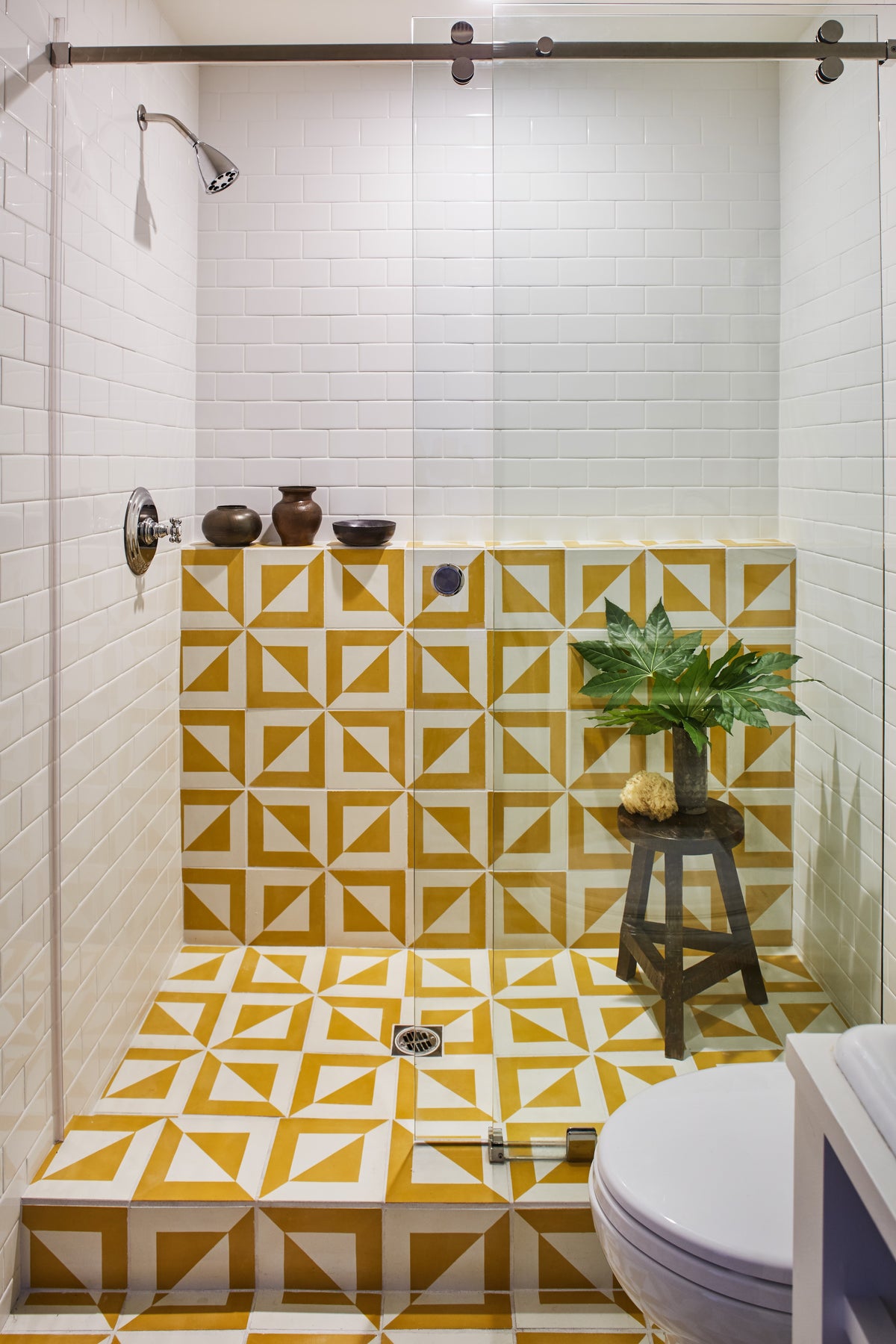 Yellow geometric tile lining the shower, Martin & Brockett Studio City bathroom