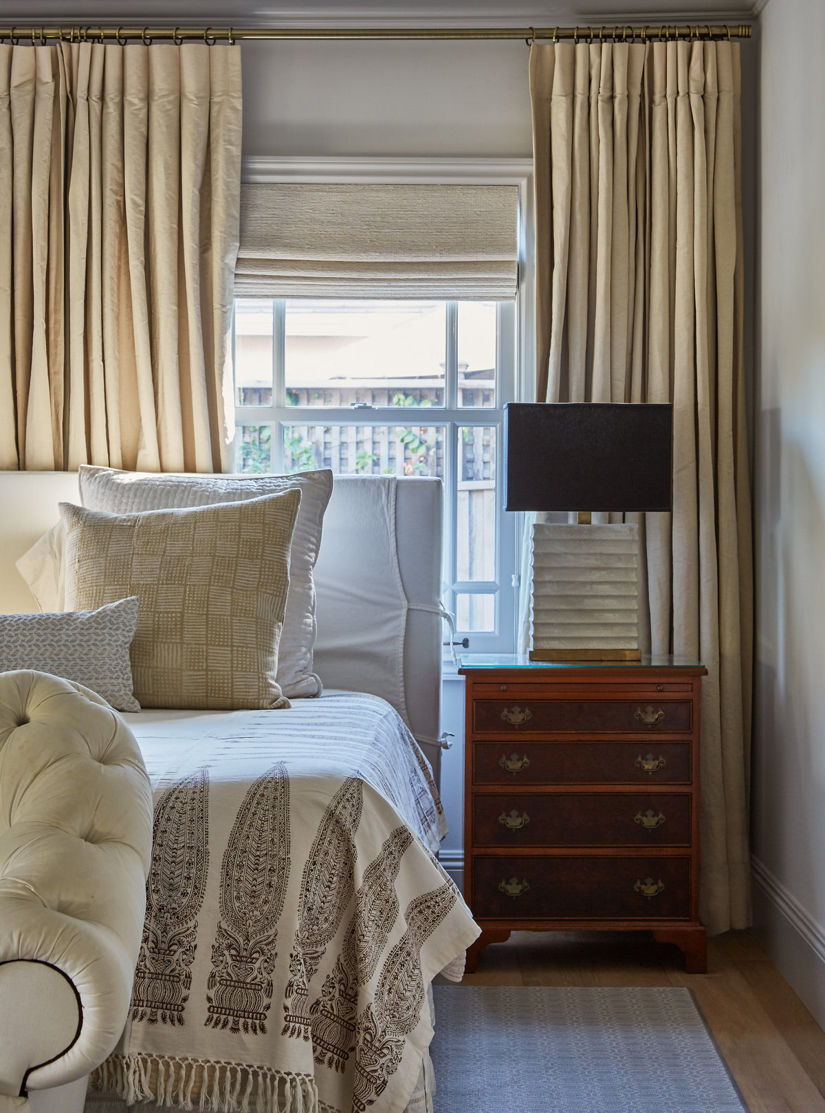Block print coverlet and antique chest of drawers in the bedroom, Martin & Brockett Studio City