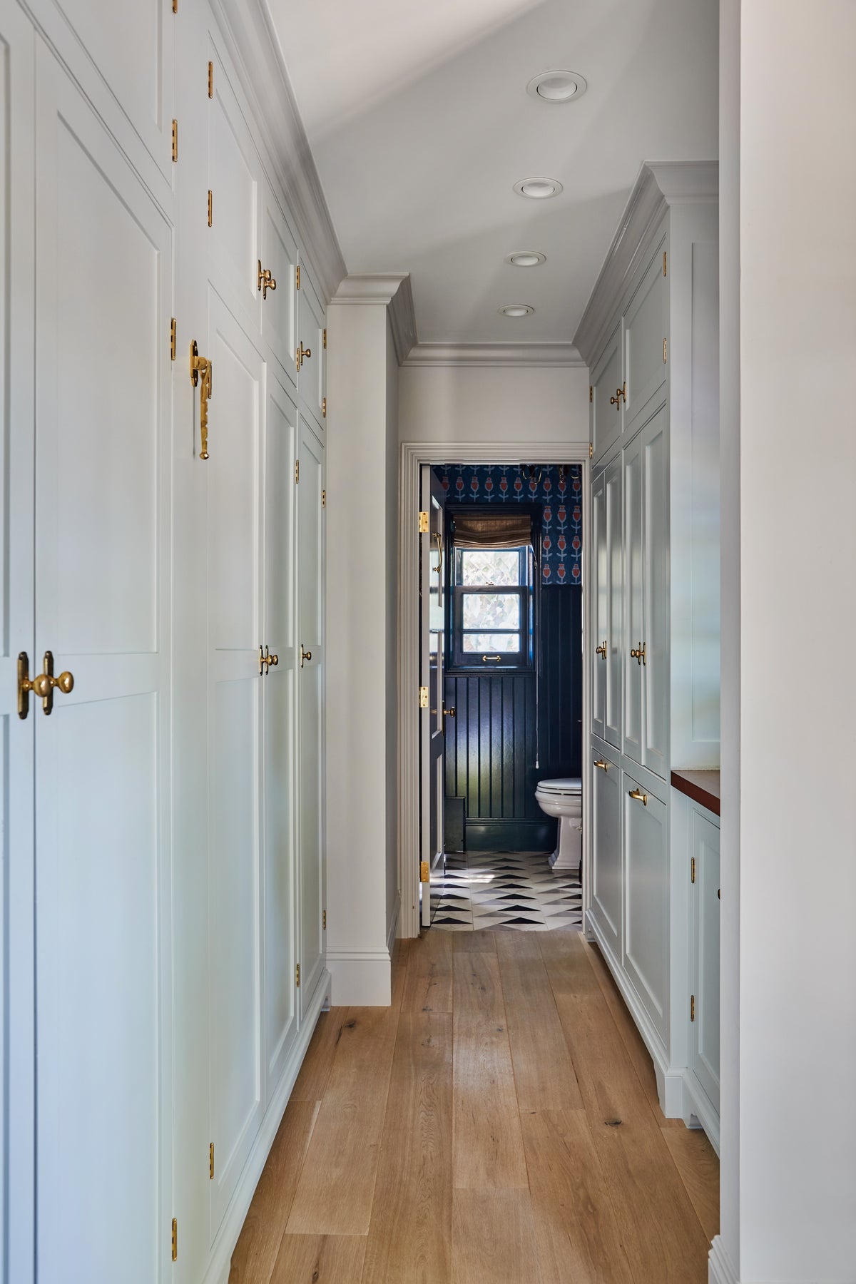 Pale blue built-in cabinetry lining the dressing hall, Martin & Brockett Studio City