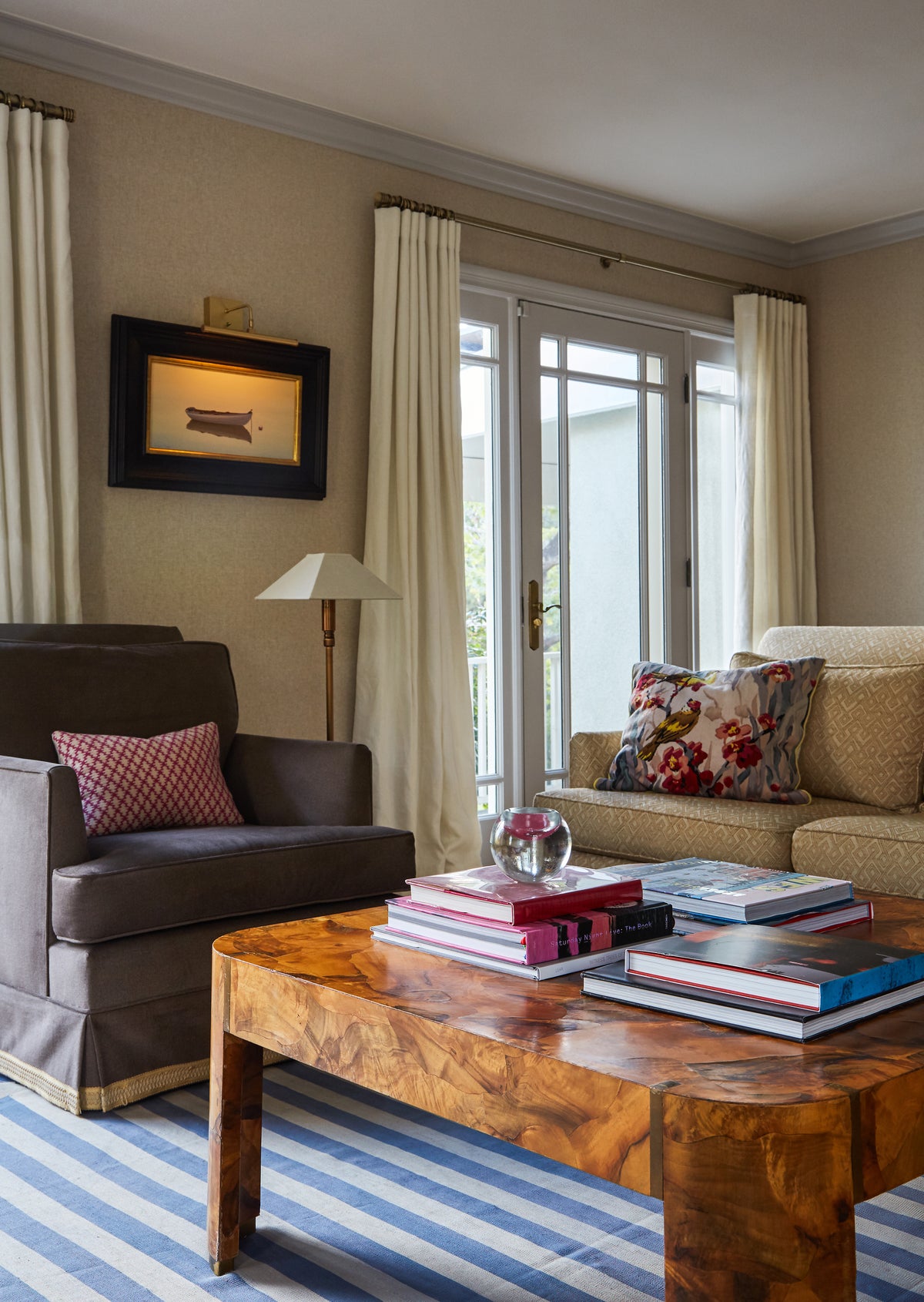 Velvet sofa and blue striped rug in the Studio City living room by Martin & Brockett