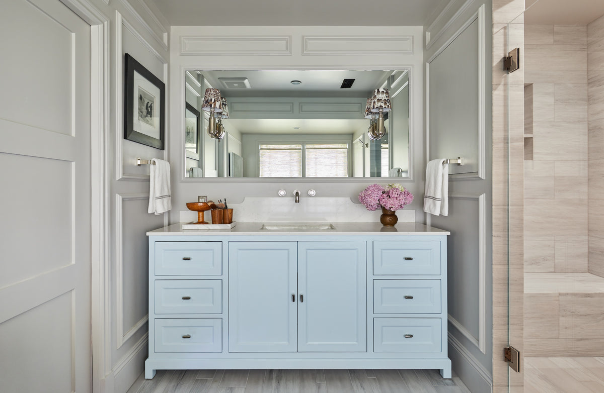 Crystal sconces above a pale blue double vanity, Martin & Brockett Studio City primary bathroom