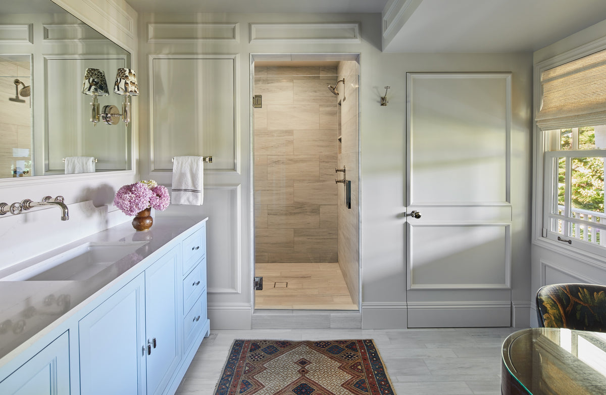 Walk-in shower and antique runner in the primary bathroom, Martin & Brockett Studio City