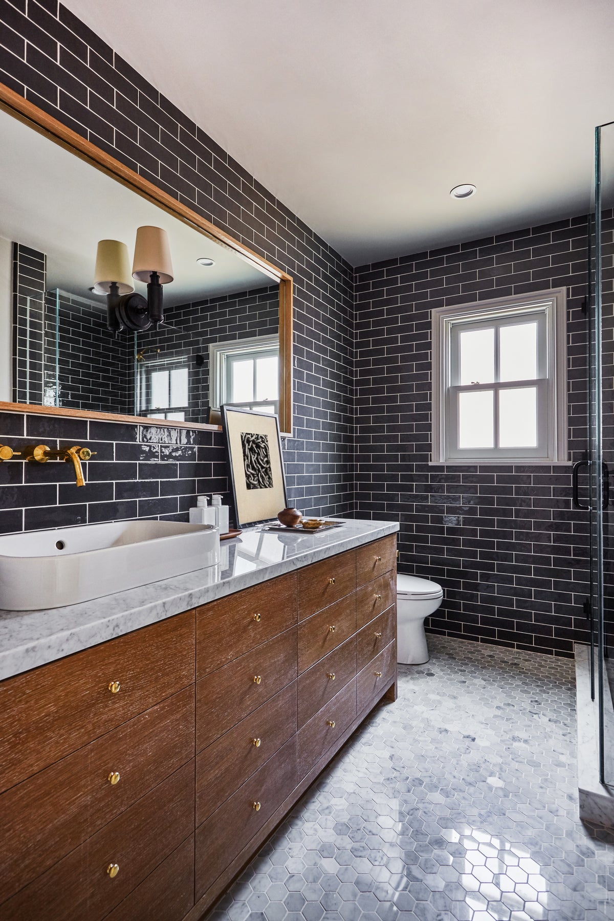 Black subway tile and a walnut vanity with marble top, Martin & Brockett Toluca Lake bathroom