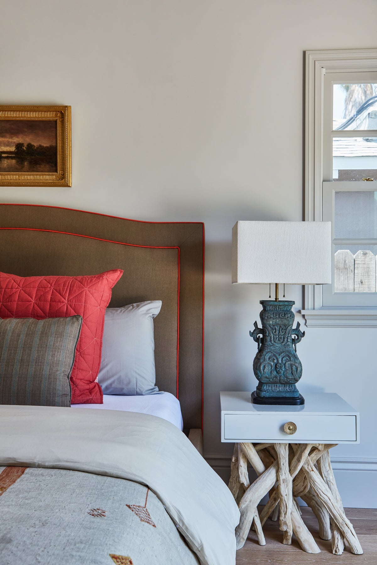 Blue ceramic lamp on a driftwood nightstand beside the bed, Martin & Brockett Toluca Lake guest bedroom