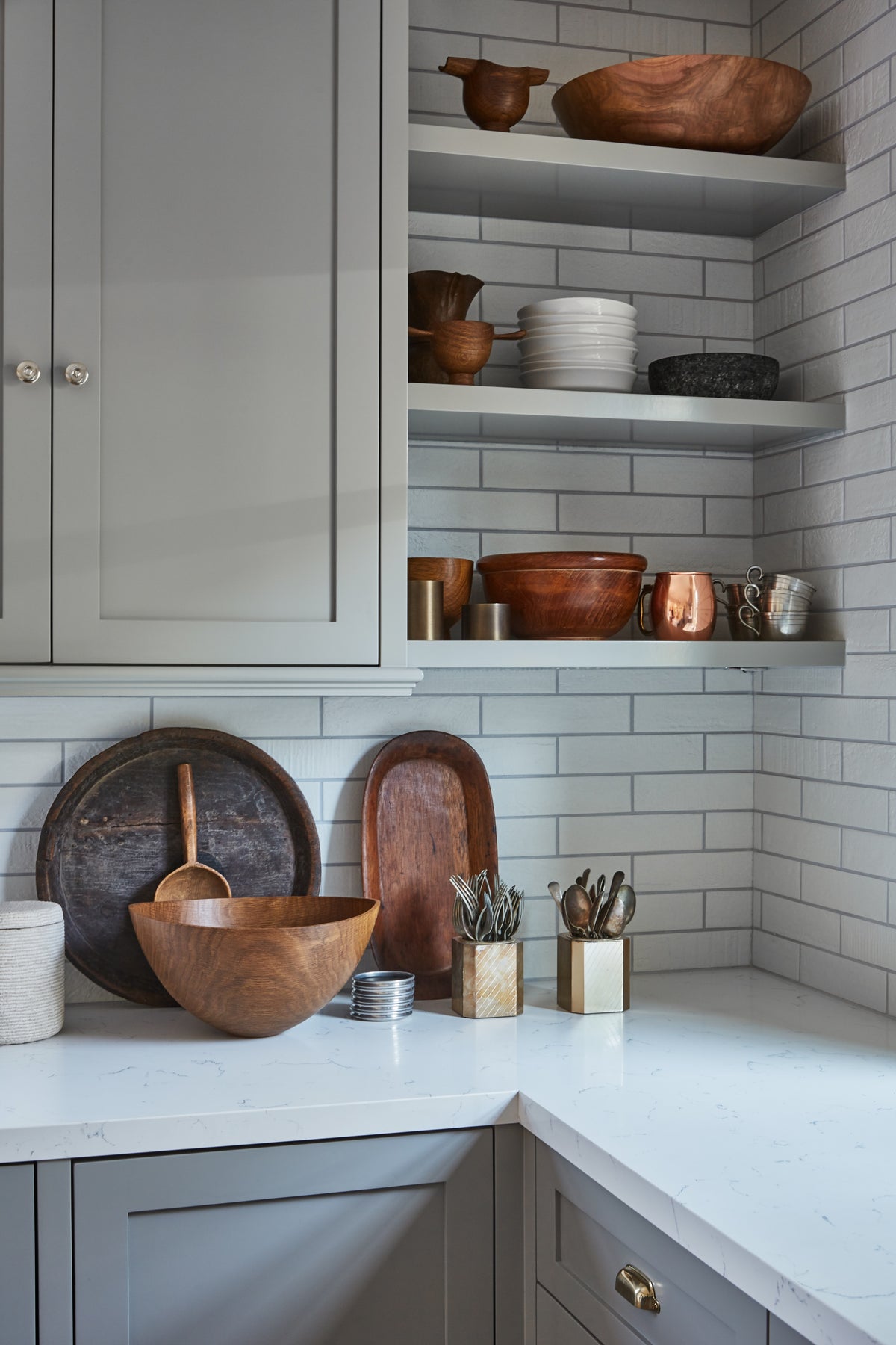 Carved wood bowls and boards on open kitchen shelving, Martin & Brockett Toluca Lake