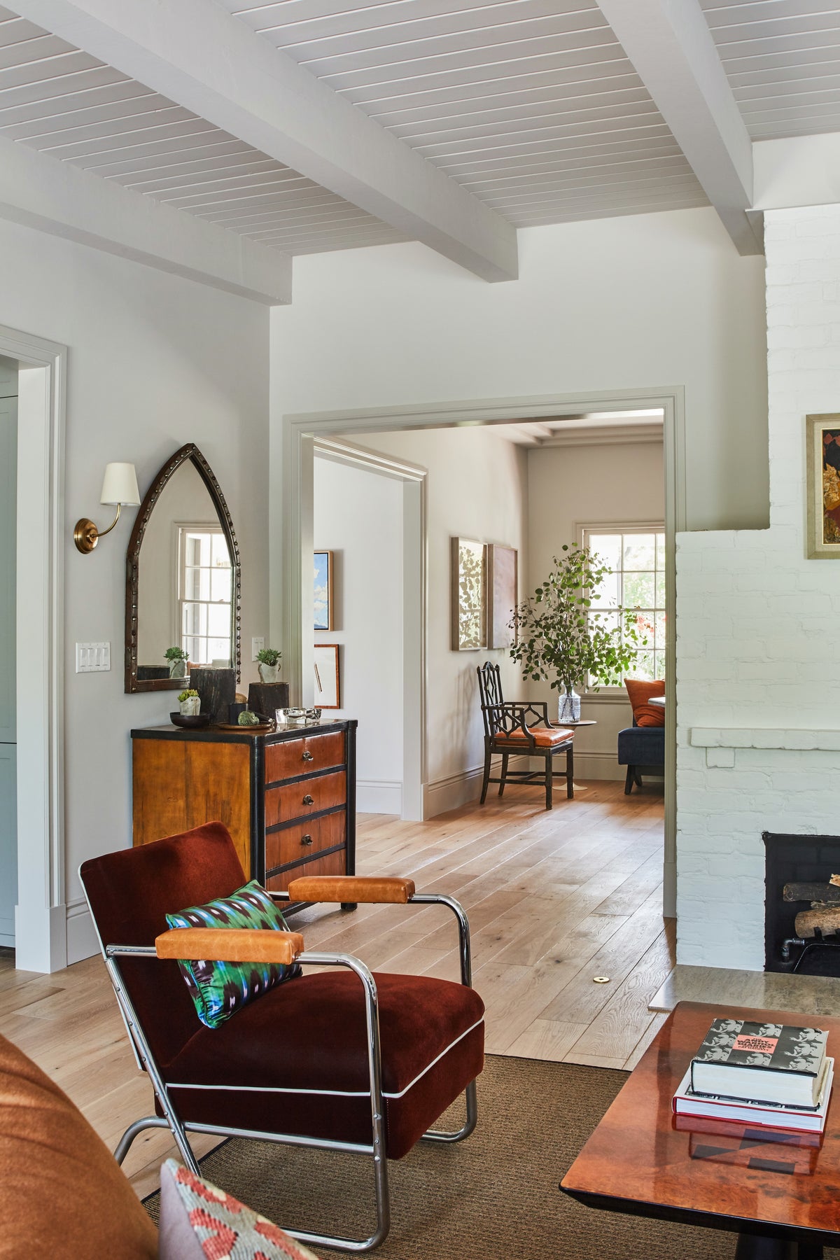 Beamed ceiling and leather chair looking through to the entry, Martin & Brockett Toluca Lake