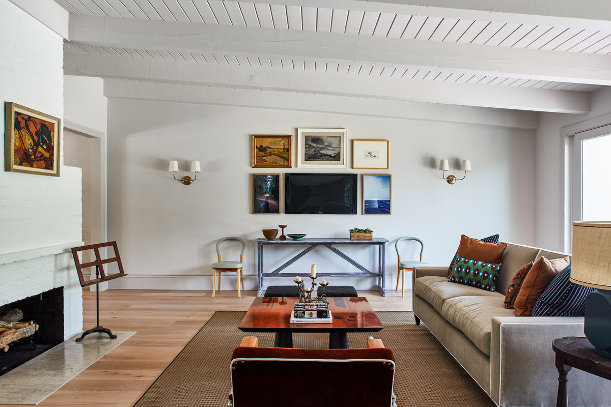 White brick fireplace and gallery wall under a planked vaulted ceiling, Martin & Brockett Toluca Lake